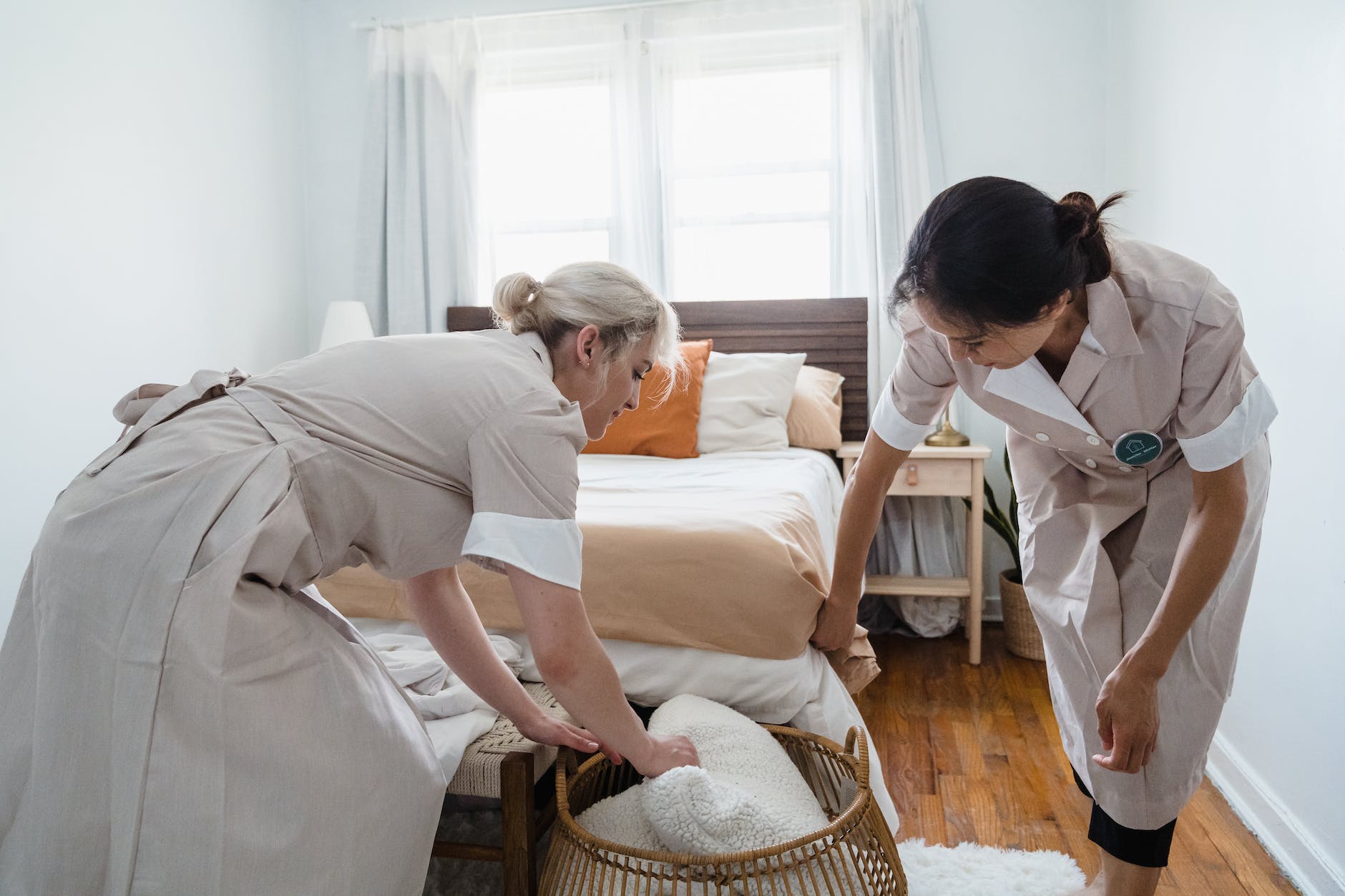 women cleaning the bedroom